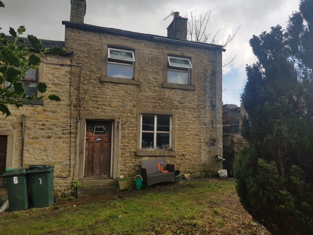Deed-related property house in England, showing a traditional stone-built home with garden.