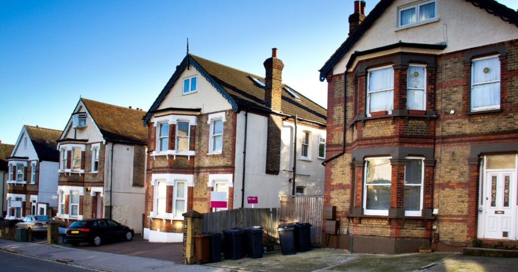 An image showcasing a row of residential houses, illustrating property ownership types relevant to the debate on whether freehold is better than leasehold.