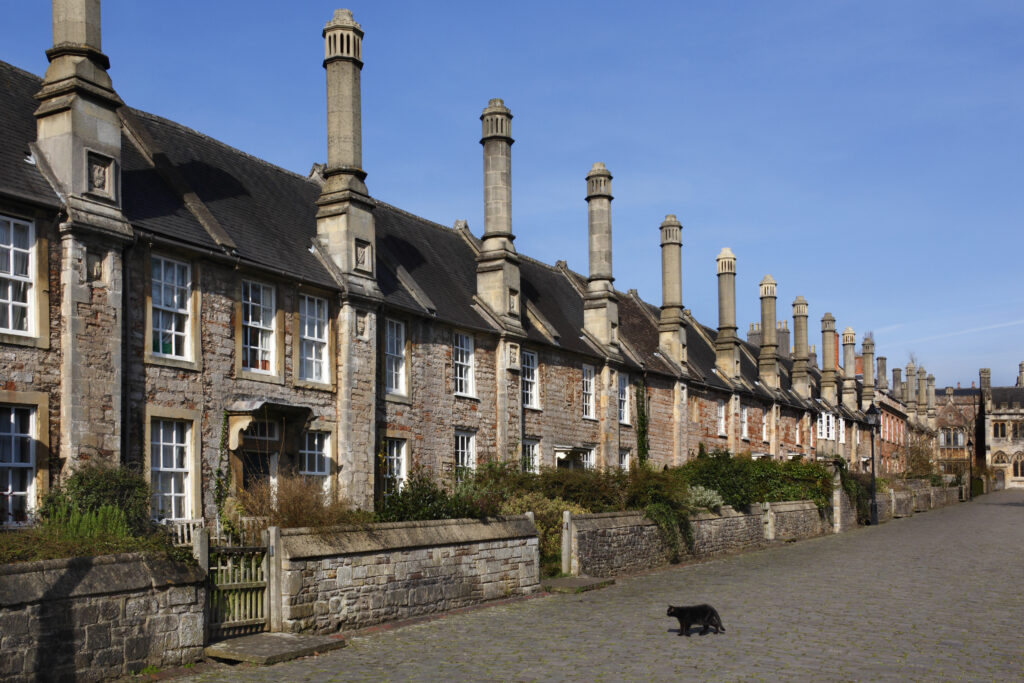 Charming historic terraced houses with distinctive chimneys, located in a traditional UK neighbourhood, illustrating the type of property involved in estate and probate considerations.