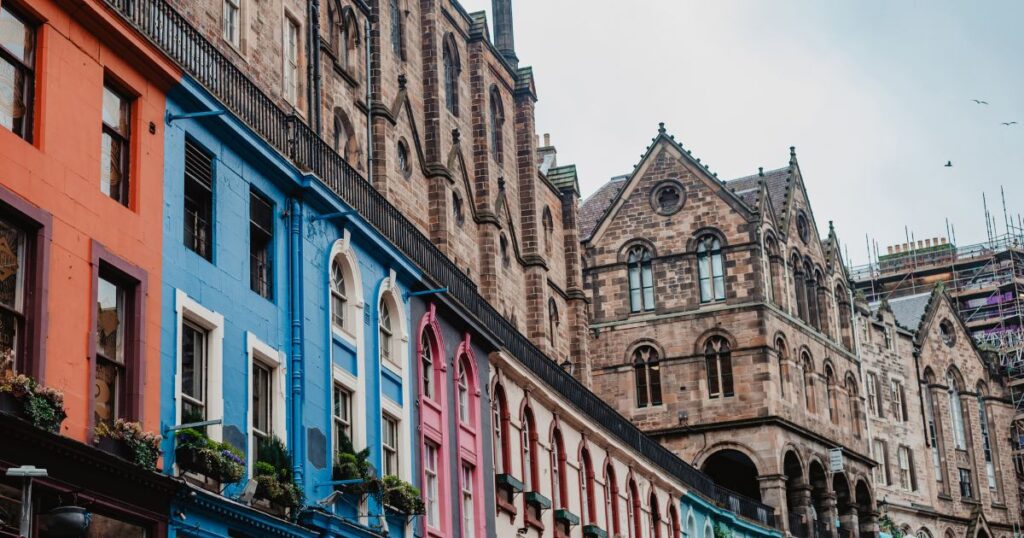 Colourful Victorian townhouses in Edinburgh showcasing historic architecture and vibrant facades.