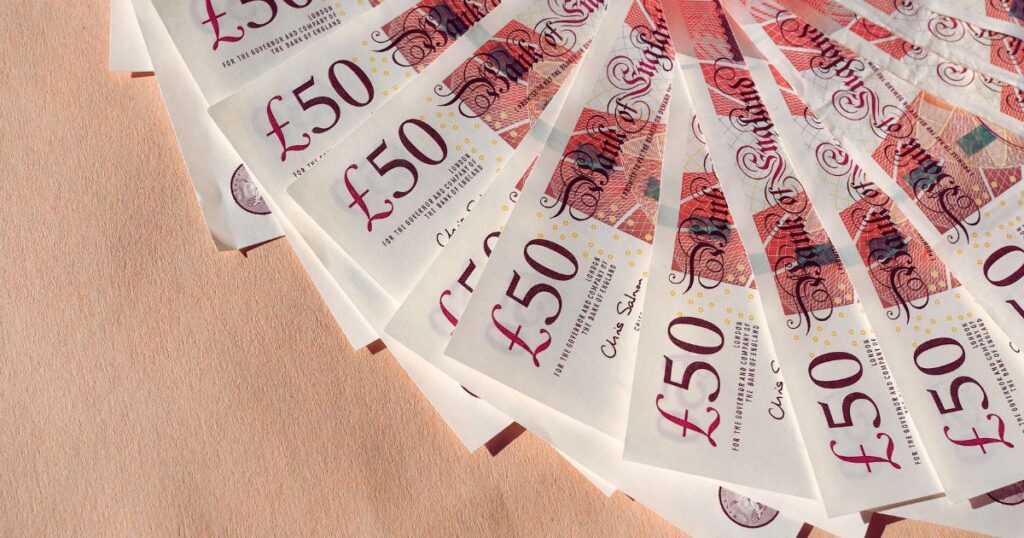 &pound;50 British banknotes fanned out, representing property investment or financial services.