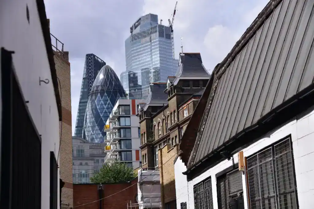 Urban cityscape showing a mix of modern skyscrapers and older buildings in London, highlighting commercial property and real estate development.