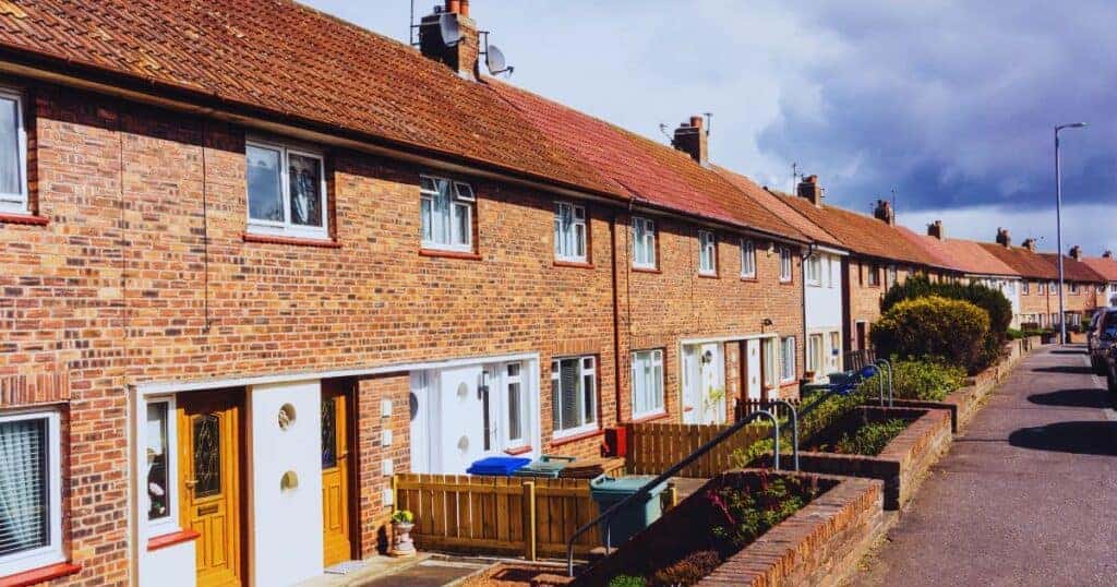 Row of brick terraced houses on a UK street, illustrating selling a house where someone has died