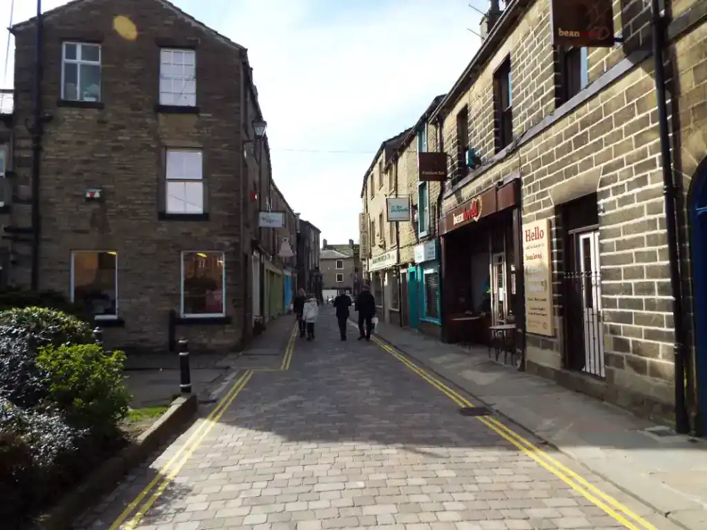 An image of a charming street with local shops, illustrating the importance of professional guidance when considering selling your commercial property.