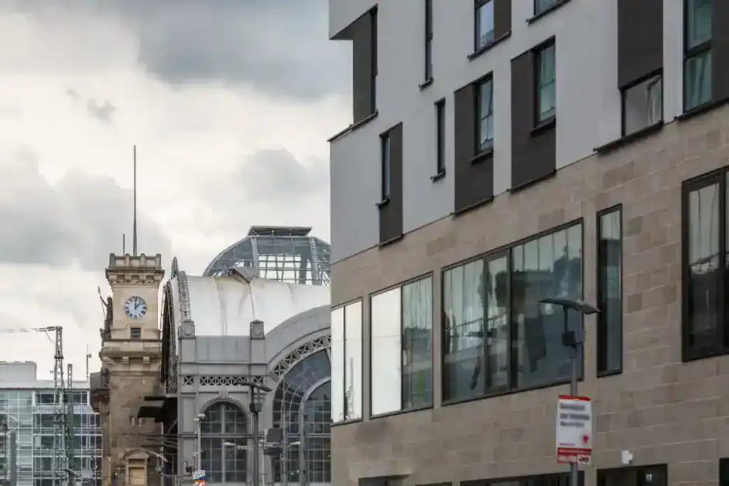 Modern commercial building with glass windows and cityscape view, highlighting property investment and development opportunities.