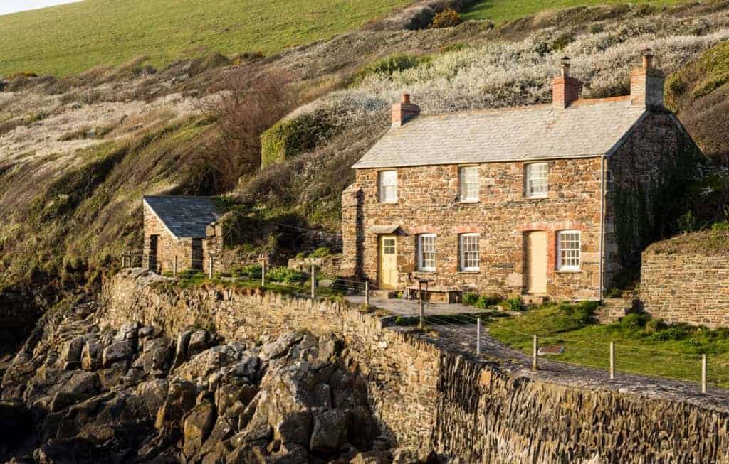 Charming stone cottage on coastal cliffs, ideal property solution, seaside retreat, renovation opportunity, property saviour, UK coastal property, historic cottage, scenic views, seaside home investment, property restoration.