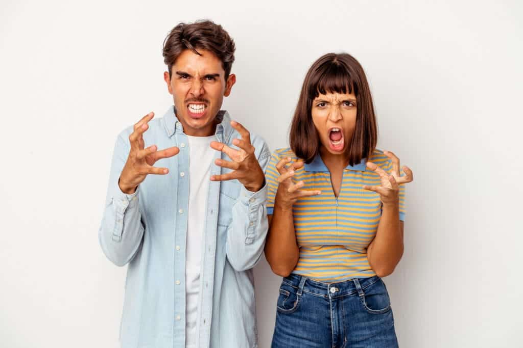 Frustrated couple expressing anger or stress, angry emotional reaction, rental property dispute, property management stress, Property Saviour solutions for property issues, resolving property conflicts.
